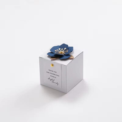 Elegant and Simple white party favor box with dark blue flower accent