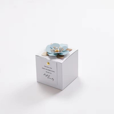 Elegant and Simple white party favor box with light blue flower accent